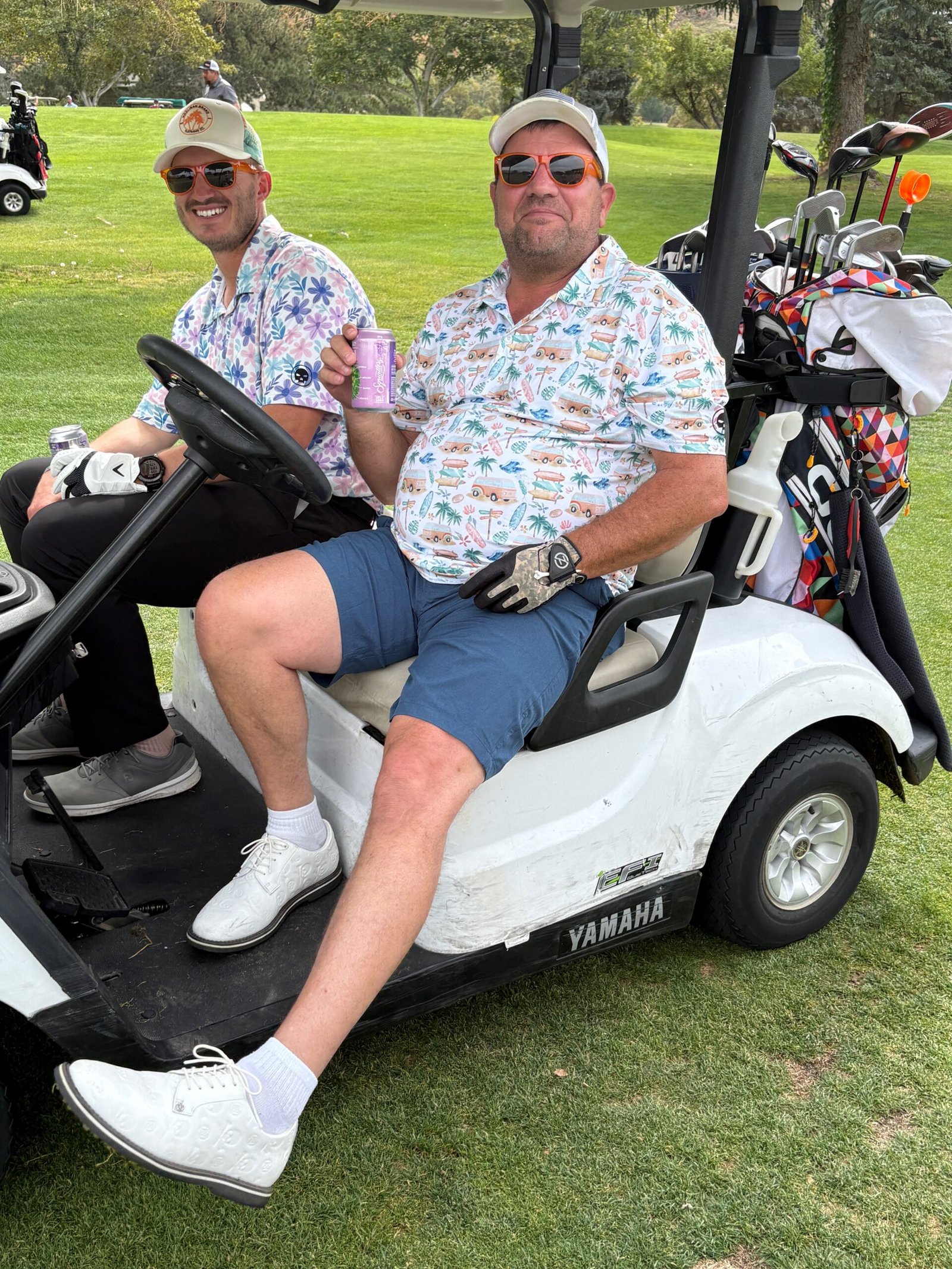 Three Hooligans wearing Hooligan polos after a round